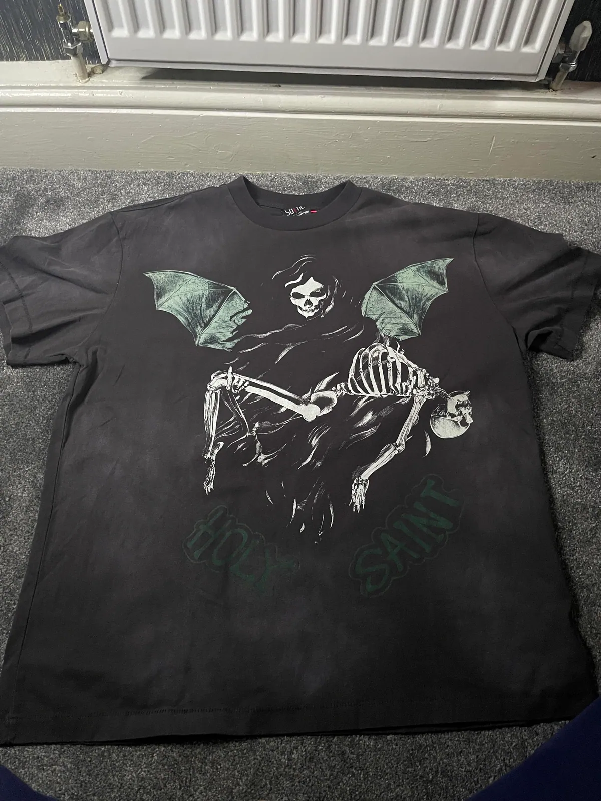 Black T-shirt with a hooded winged skeleton graphic