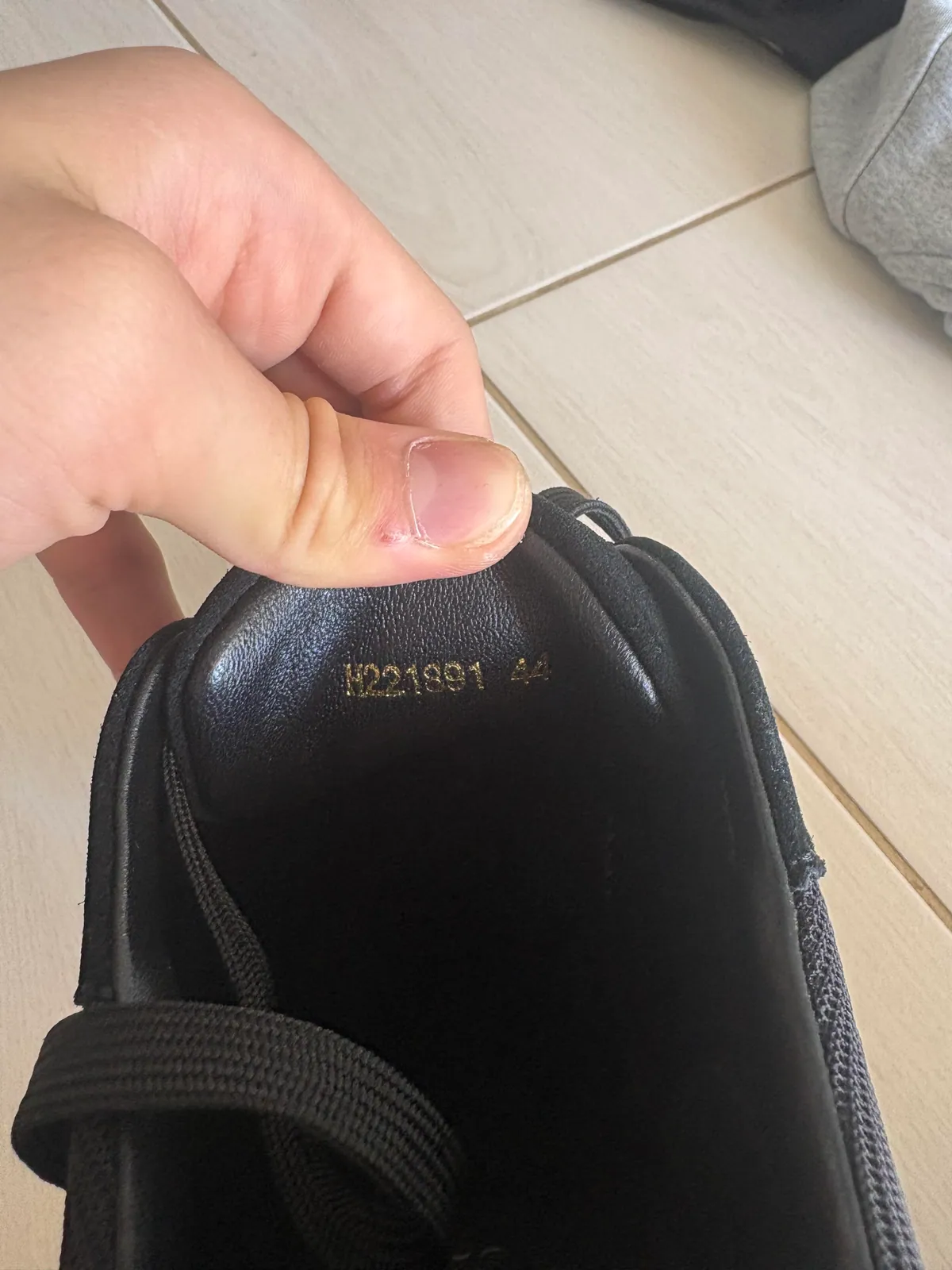 Close-up of the printed lining inside a black shoe