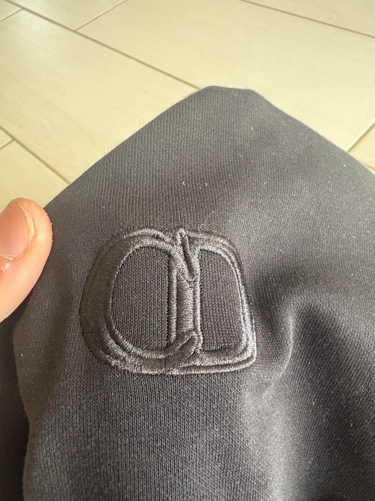 Tonal embroidery on black fabric