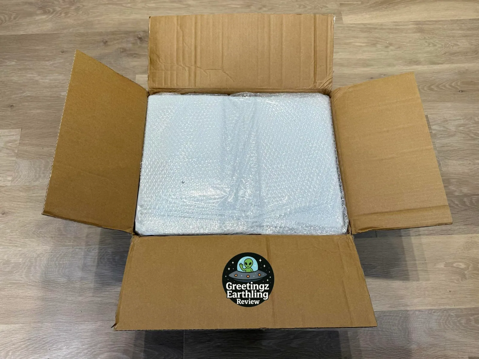 Open cardboard box with protective foam inside