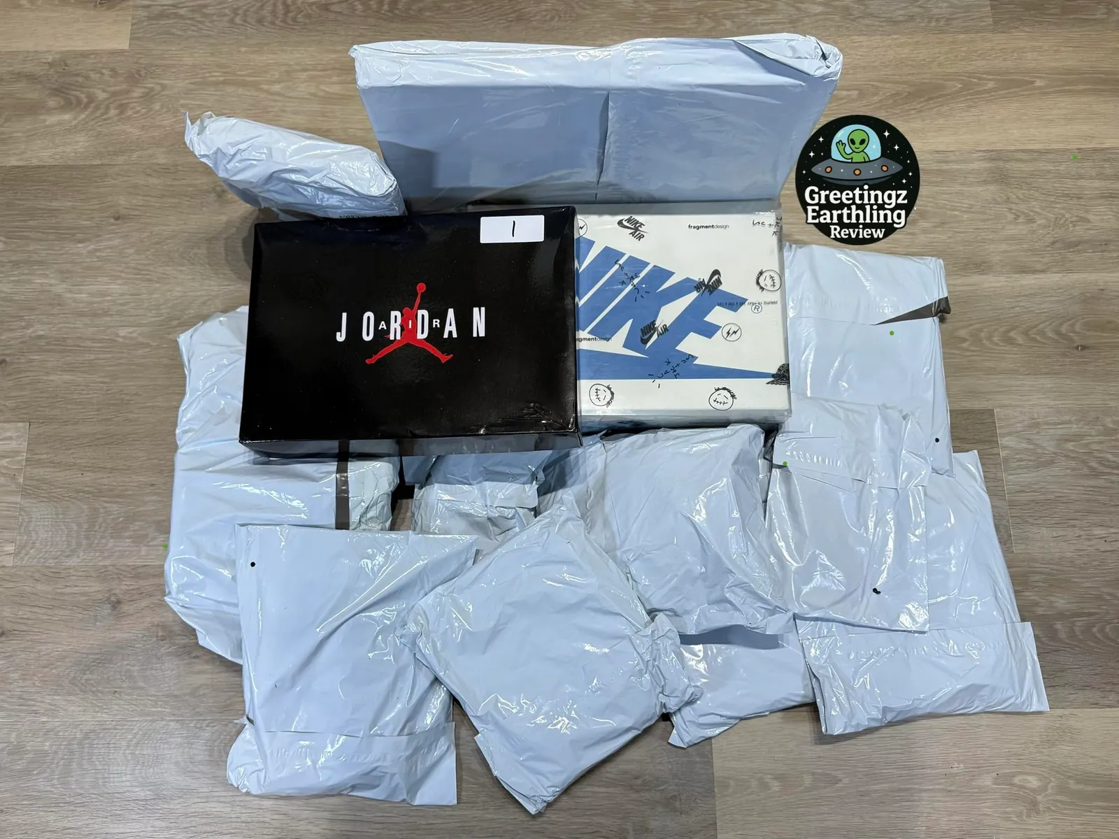 Shoe boxes and sealed clothing parcels arranged on the floor