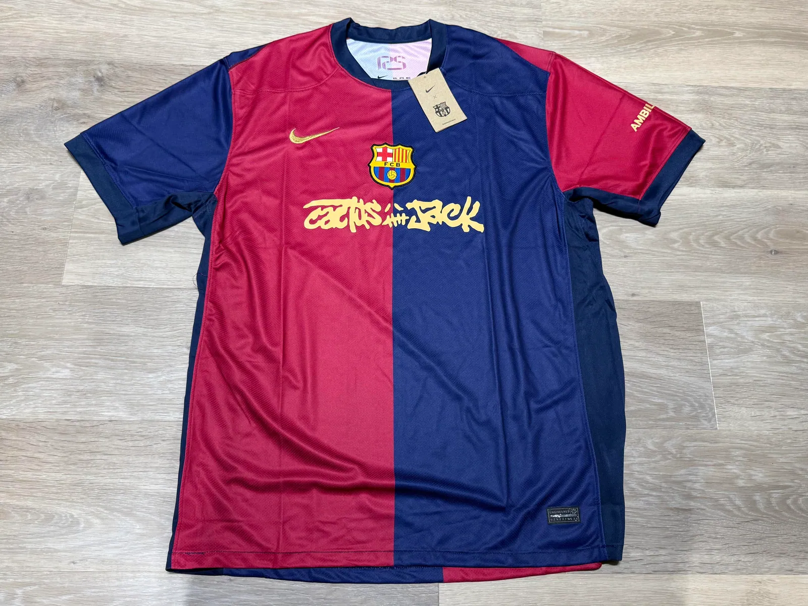 Red and navy football jersey laid flat