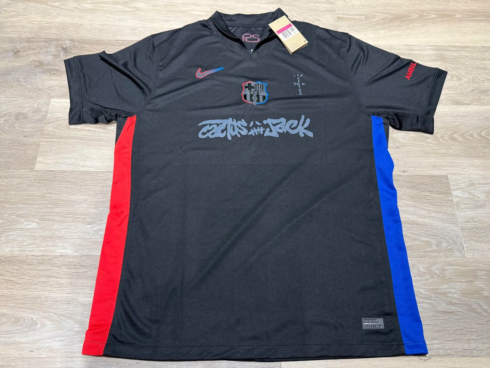 Dark football jersey with red and blue side panels