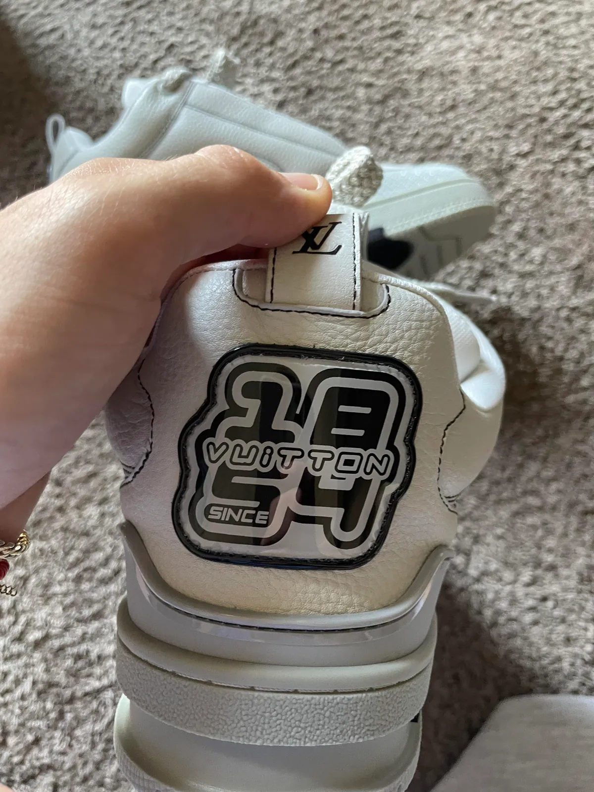 Close-up of the heel of a white chunky sneaker