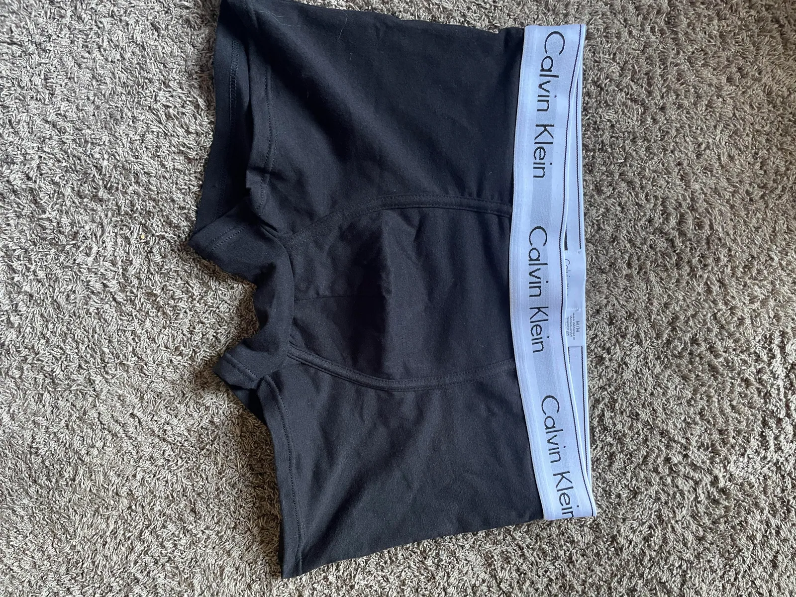 Pair of dark boxer briefs with a light waistband