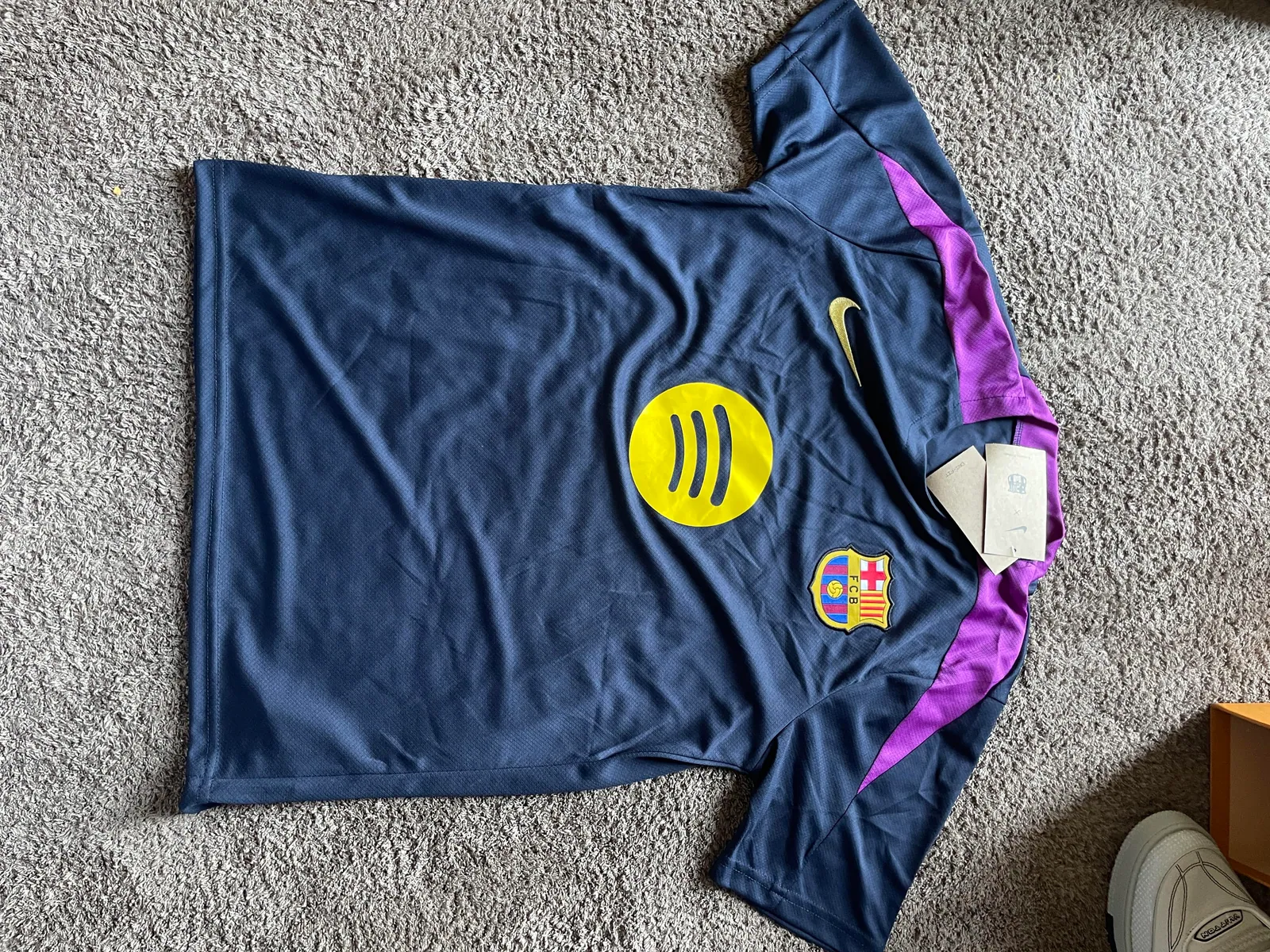 Dark football jersey with purple shoulder panels